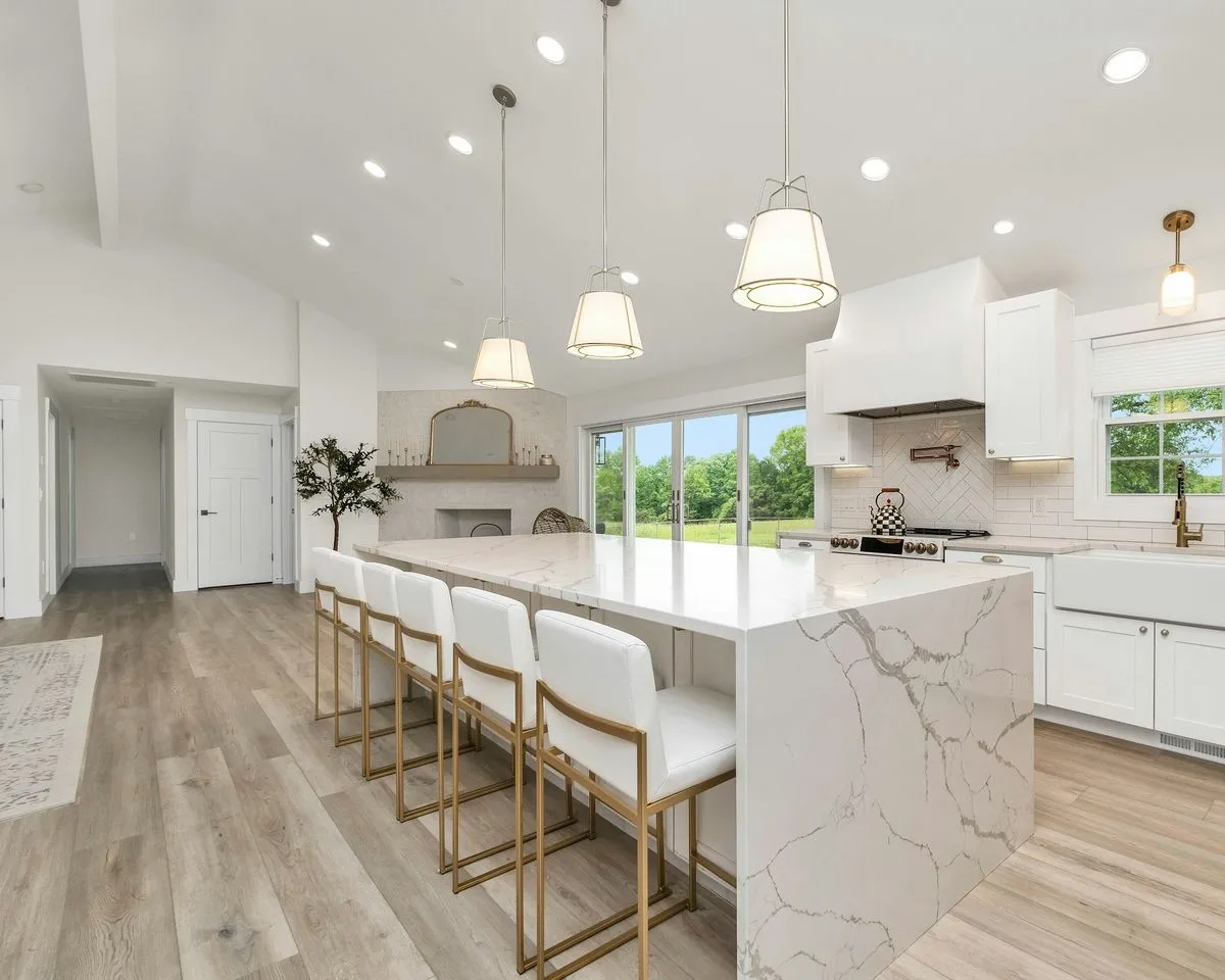Bright white kitchen with a marble island, cleaned and tidy